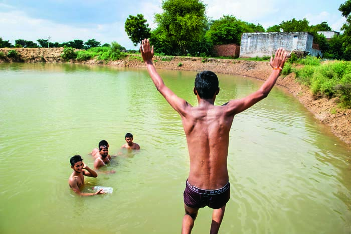 Young ones take a dip in the pond at Khatawali 