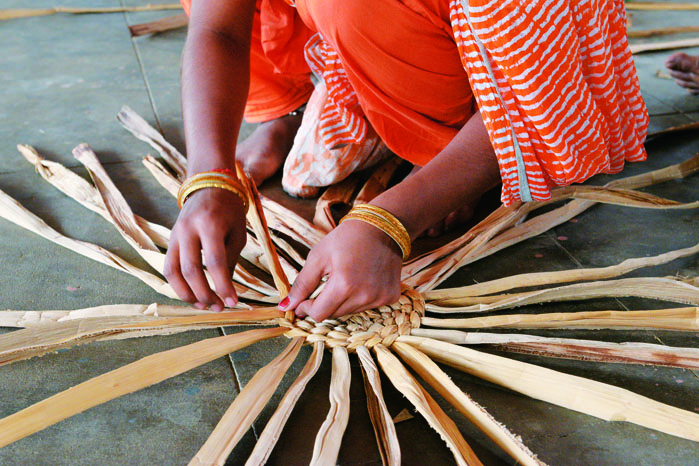 women are being skilled to make decorative items from banana bark in Namakkal